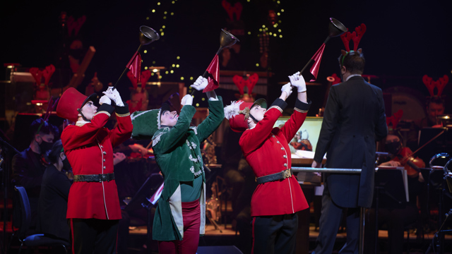 This Way to Christmas - three people on stage with bugles