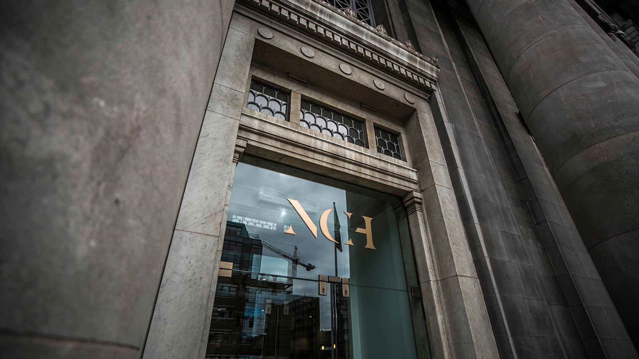 Outdoor shot of the door of the NCH with the gold logo above the door