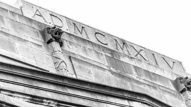 Roman numerals on a grey building