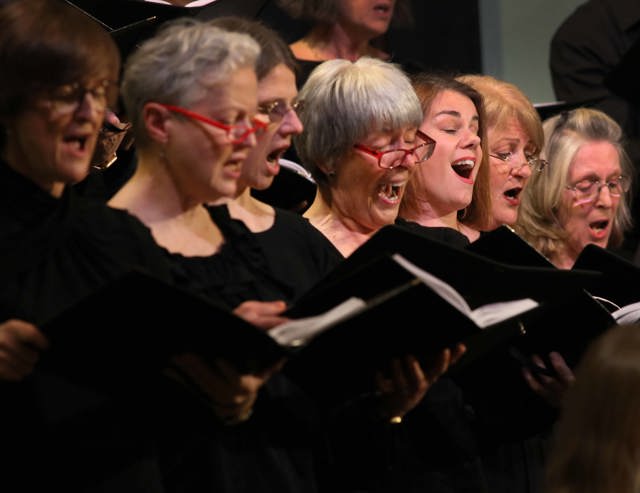 National Symphony Chorus - female members of the choir dressed in black holding their songbooks