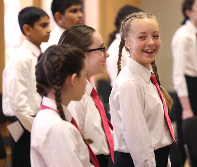 Cór na nÓg - young girls in white shirts and pink ties